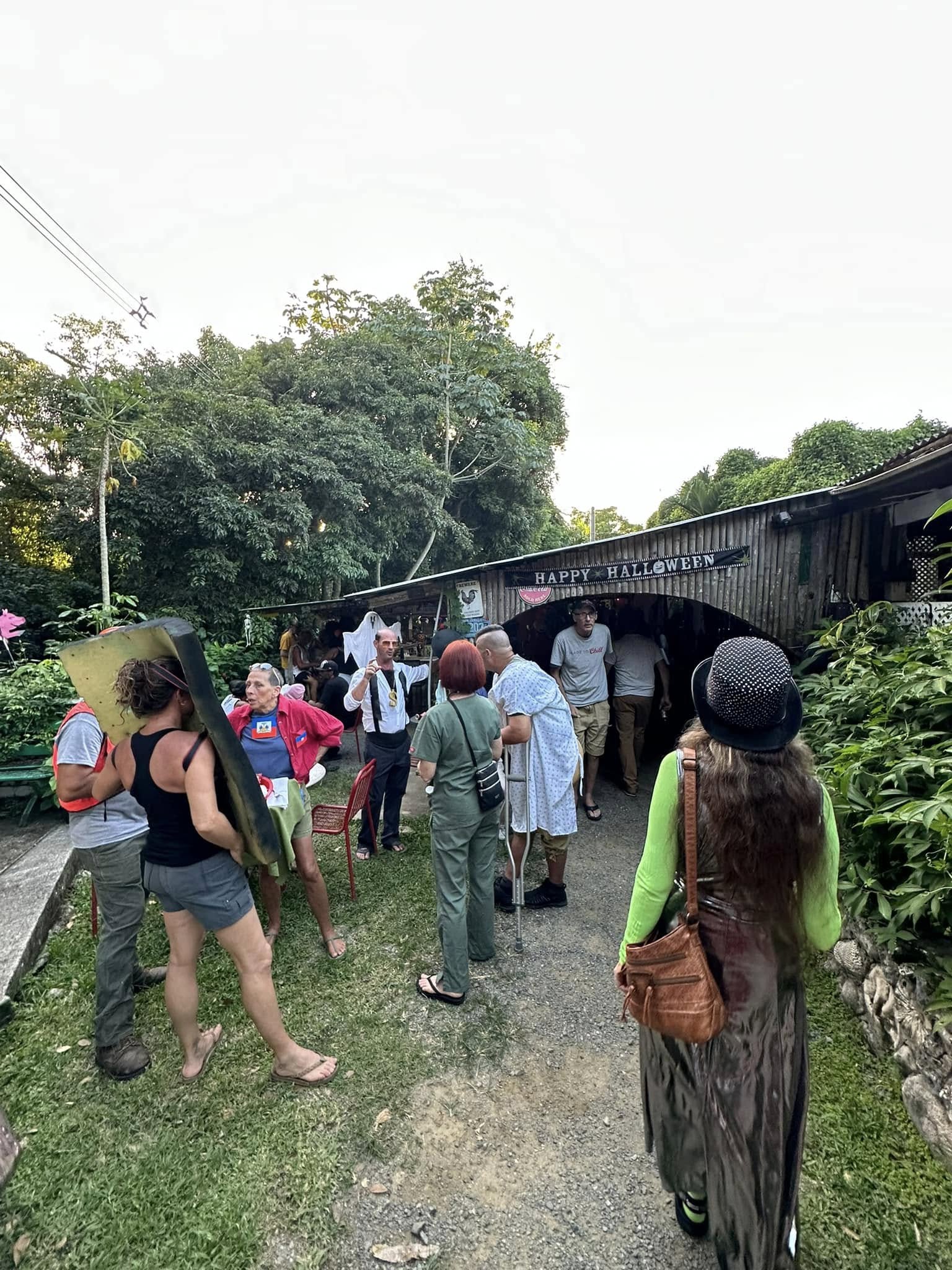Halloween celebration at the Domino Club with costumed visitors gathering at the entrance